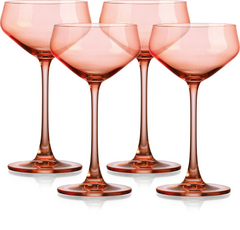 Set of Four Translucent Blush Coral Coupe Glasses.