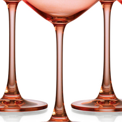 Set of Four Translucent Blush Coral Coupe Glasses.