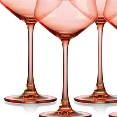 Set of Four Translucent Blush Coral Coupe Glasses.